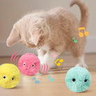 The colorful and vibrant feathers of the Feline Fun Frenzy Ball by HappinessPaws™, attracting cats' attention and curiosit