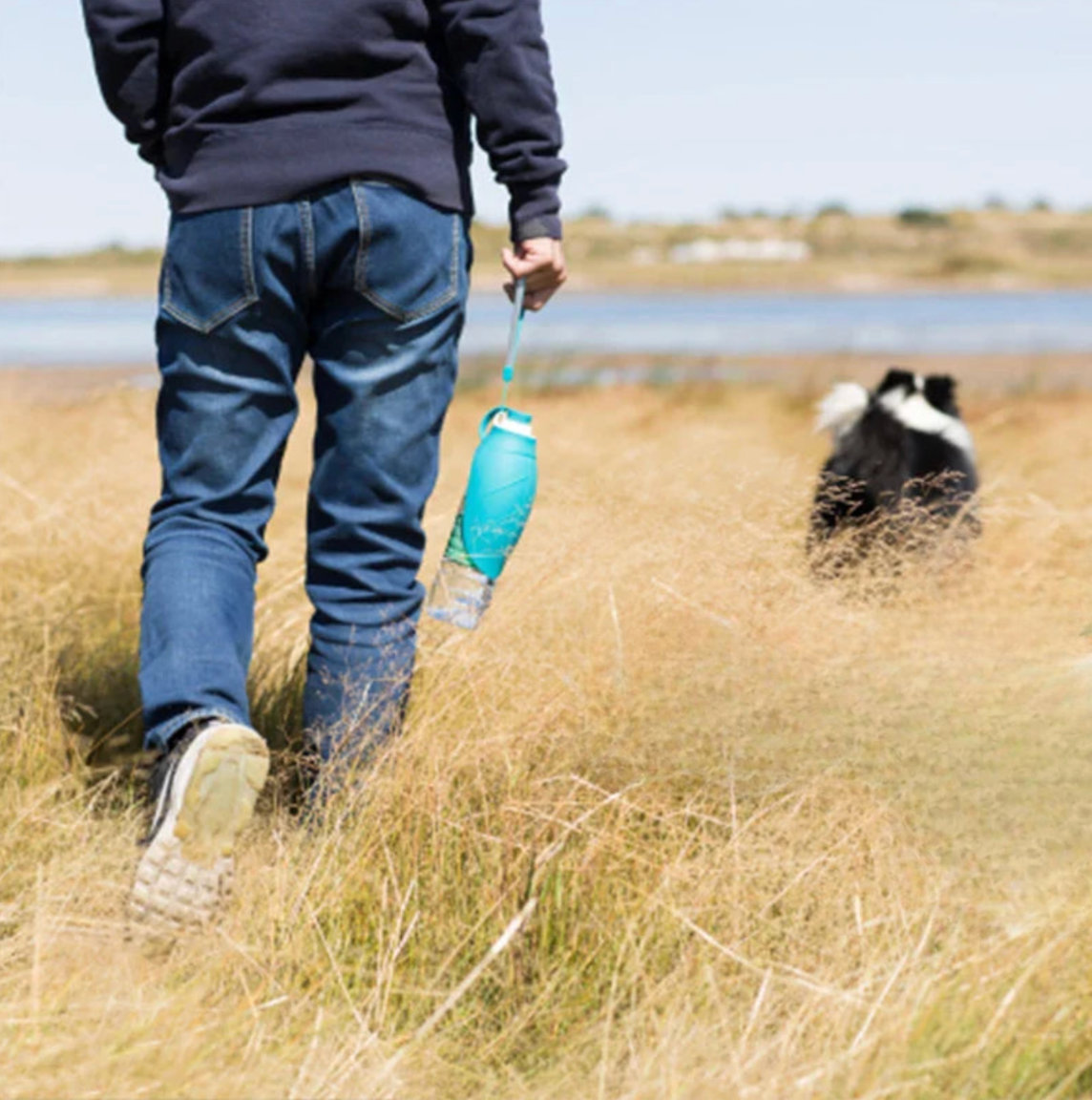 The Travel Water Bottle for Dogs by HappinessPaws™, a convenient solution for keeping your canine companion hydrated on the go.