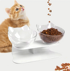 A cat happily eating from the Elevated Cat Double Bowl by HappinessPaws™, enjoying mealtime comfort