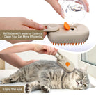 Cat enjoying a spa-like grooming session with the refillable 3 in 1 Water Cat Brush by HappinessPaws™, designed for water or essence application.