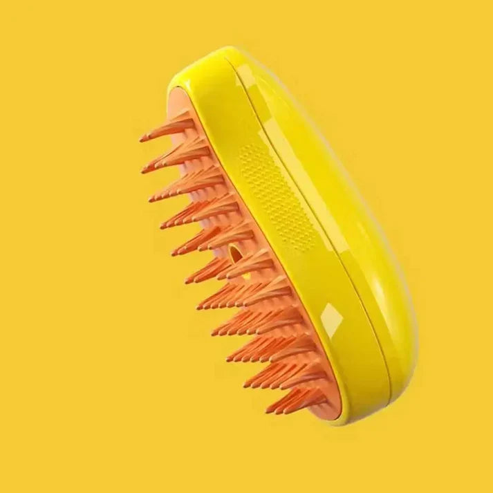 Yellow version of the HappinessPaws 3 in 1 dog grooming brush, showing flexible bristles against a yellow background.