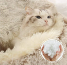 Cat relaxing in a beige fluffy cozy cocoon bed with close-up of soft filling material