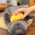 Person brushing relaxed gray cat's belly with HappinessPaws® Cat Steamy Brush.