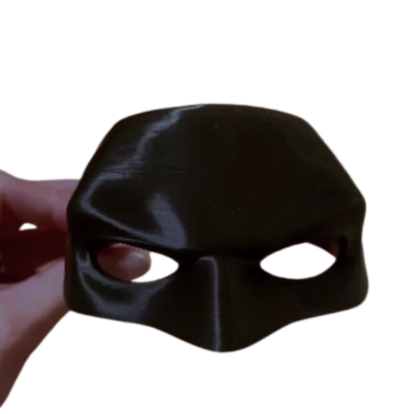 Hand holding the Cat Batman Mask™ up close, highlighting the mask’s quality material.