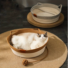 Cat peacefully sleeping in the Chic Osier Cat Bed by HappinessPaws™, with another empty bed in the background.