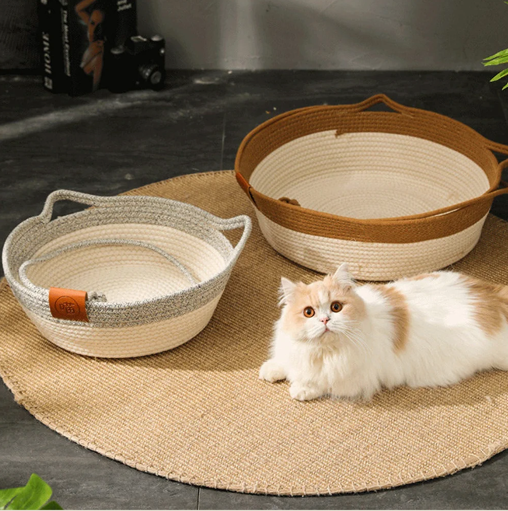 Natural wicker Chic Osier Cat Bed by HappinessPaws™ with green background elements, blending comfort with decor.